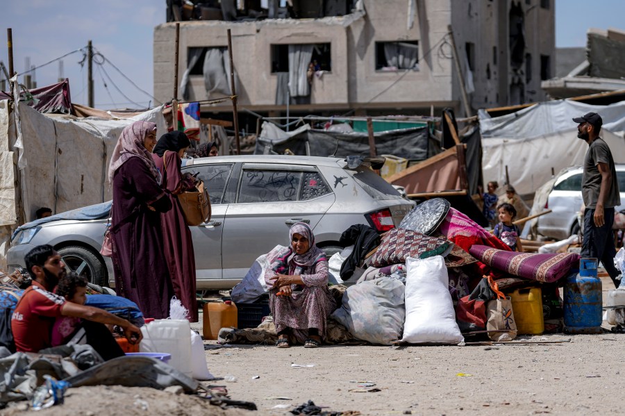 Palestinians displaced by the Israeli air and ground offensive on the Gaza Strip flee from Hamad City, following an evacuation order by the Israeli army to leave parts of the southern area of Khan Younis, Sunday, Aug. 11, 2024. (AP Photo/Abdel Kareem Hana)