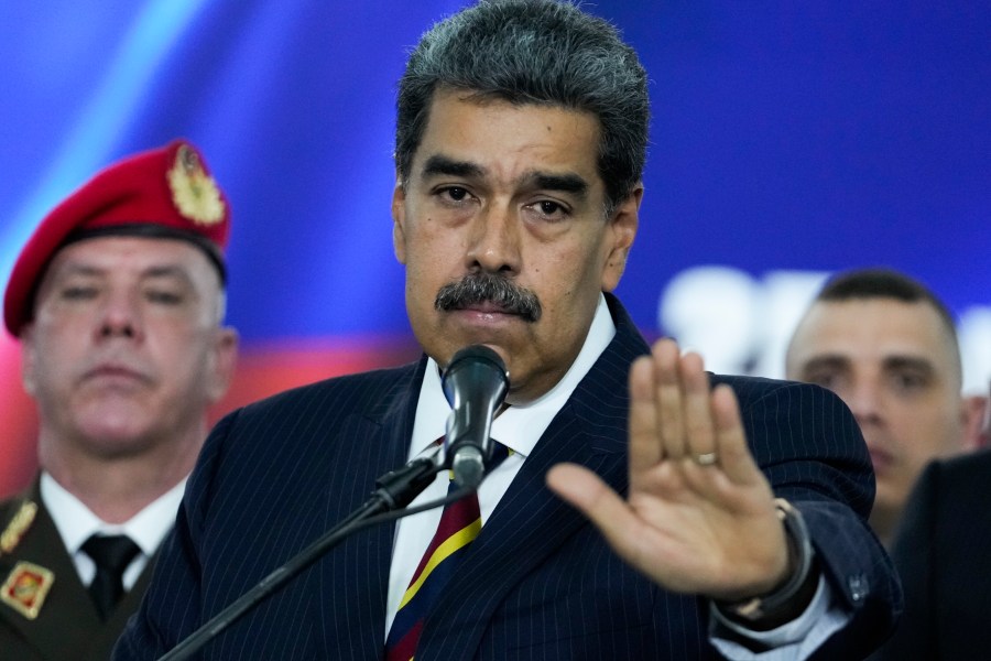 Venezuelan President Nicolas Maduro speaks to the press before leaving the Supreme Court where he arrived for procedures related to the court's audit of presidential election results in Caracas, Venezuela, Friday, Aug. 9, 2024. (AP Photo/Matías Delacroix)