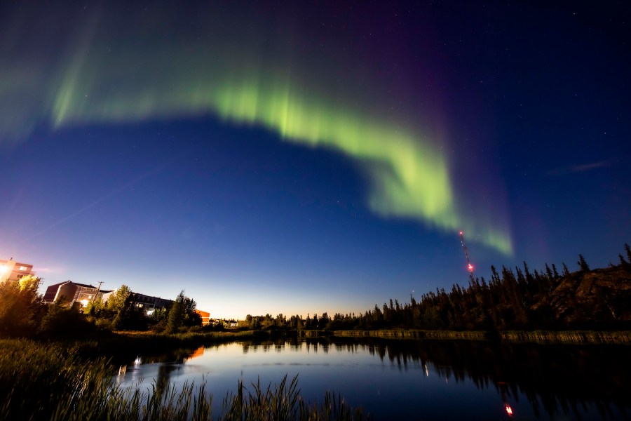 The northern lights, or the aurora borealis, appear in the sky over Rat Lake in Yellowknife, Northwest Territories on Thursday, Aug.8, 2024. (Bill Braden /The Canadian Press via AP)