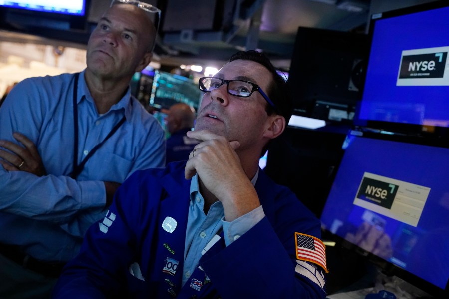 FILE - Specialist John McNierney, right, works with a colleague on the floor of the New York Stock Exchange, Aug. 7, 2024. (AP Photo/Richard Drew, File)