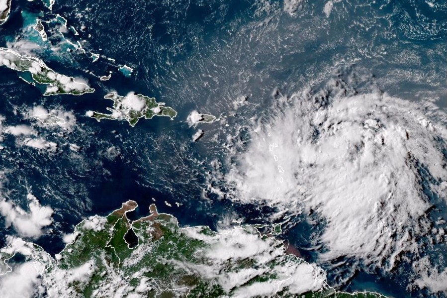 This GOES-16 GeoColor satellite image taken at 4:30 p.m. EDT and provided by National Oceanic and Atmospheric Administration (NOAA) shows Tropical Storm Ernesto over the Atlantic Ocean and moving west-northwest toward the Lesser Antilles, Monday, Aug. 12, 2024. (NOAA via AP)