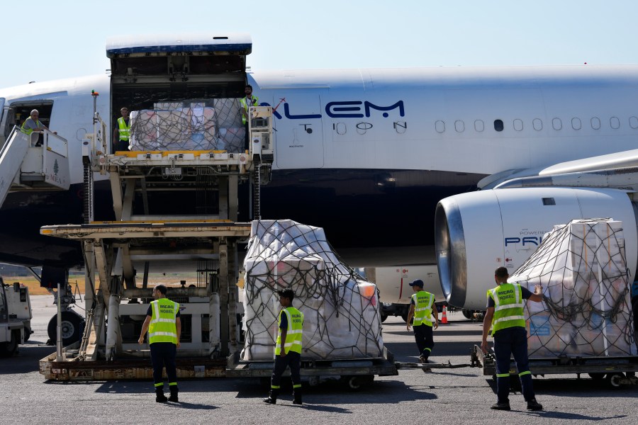 FILE - Lebanese airport workers unload medical aid boxes, which are part of preparedness by the medical sector in Lebanon in case an all-out war breaks out between Israel and Hezbollah, Monday, Monday, Aug. 5, 2024, at Rafik Hariri International Airport in Beirut, Lebanon,. Lebanon's healthcare, battered by years of crises, is scrambling with already stretched resources to prepare for a possible wider conflict with Israel, the country's health minister told the Associated Press in an interview Monday. (AP Photo/Hussein Malla, File)