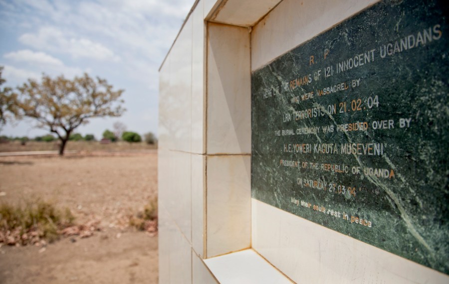 In this file photo taken Thursday, Feb. 12, 2015, a memorial marks the location of a mass burial site of those massacred in 2004 by the Lord's Resistance Army (LRA), at the Barlonyo displaced persons camp in northern Uganda. A former commander of the Lord’s Resistance Army rebel group has been convicted of dozens of crimes against humanity in a key moment of justice for many in Uganda who suffered decades of its brutal insurgency. The trial of Thomas Kwoyelo was the first atrocity case to be tried under a special division of Uganda's High Court that focuses on international crimes. (AP Photo/Rebecca Vassie, File)