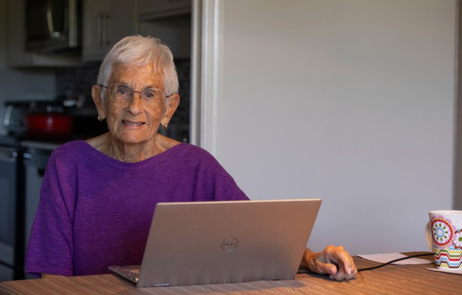 Barbara Winston, 89, sits for a portrait at her home in Northbrook, Ill., on Sunday, June 30, 2024. When she got home from an artificial intelligence class, the retired professor downloaded books on the technology, researched the platforms she wanted to use from her kitchen table and eventually queried ChatGPT about how to treat a personal medical ailment. (AP Photo/Teresa Crawford)