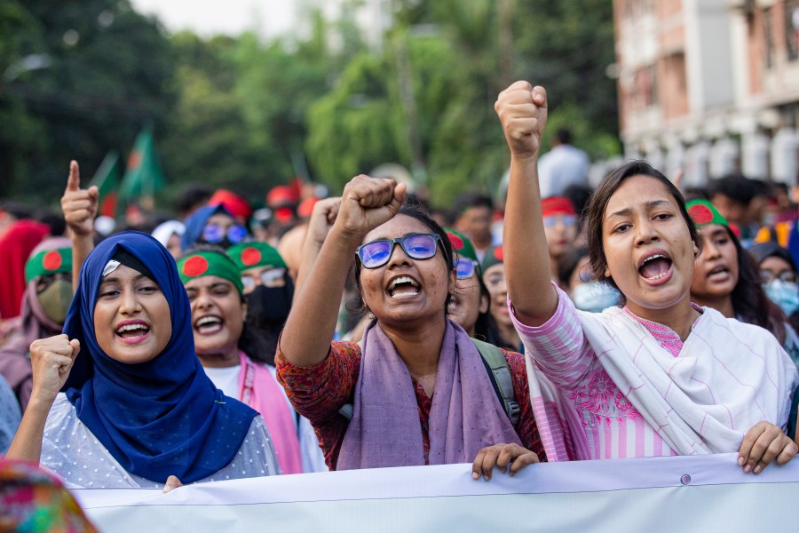 Students shout slogans during a protest demanding the trial of former Prime Minister Sheikh Hasina in Dhaka, Bangladesh, Tuesday, Aug. 13, 2024. (AP Photo/Rajib Dhar)