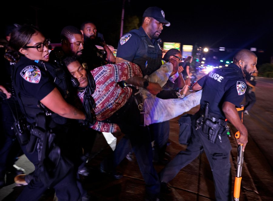 Ferguson police arrest Elijah Gant outside the Ferguson, Mo., police department on Friday, Aug. 9, 2024, after protests turned to turmoil on the 10th anniversary of Michael Brown's death at a gathering of several of the original protesters. (Christian Gooden//St. Louis Post-Dispatch via AP)