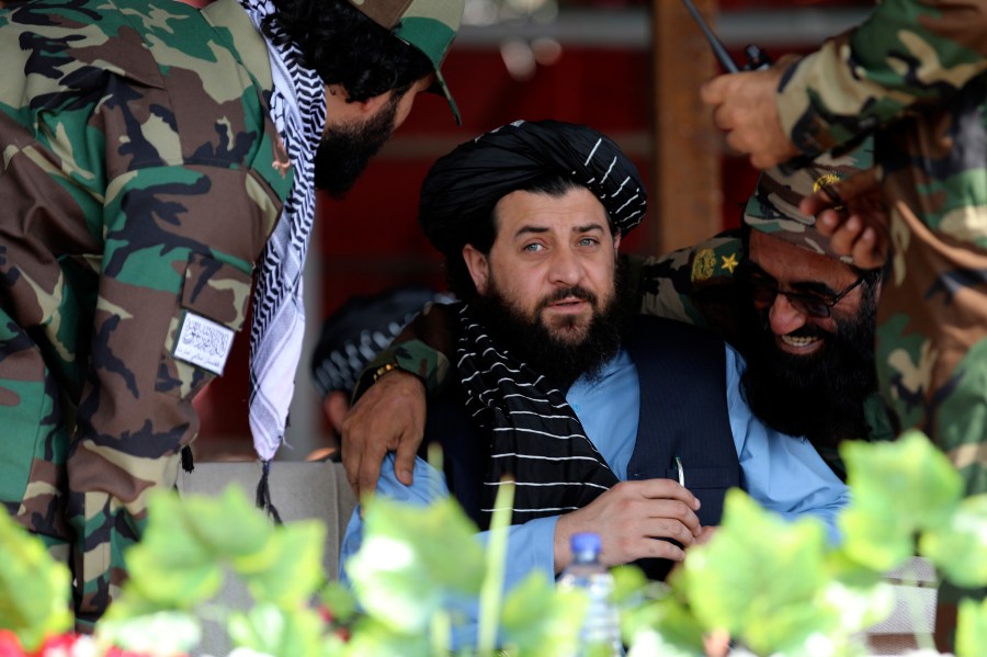 Afghan Taliban's Acting Minister of Defence Mullah Mohammad Yaqoob, center, attend during a military parade to mark the third anniversary of the withdrawal of U.S.-led troops from Afghanistan, in Bagram Air Base in the Parwan Province of Afghanistan, Wednesday, Aug. 14, 2024. (AP Photo/Siddiqullah Alizai)