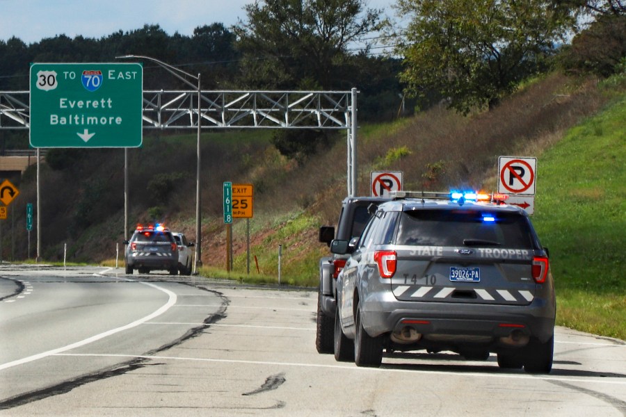 FILE - Pennsylvania State troopers pull over vehicles, Sept. 4, 2020, along the Pennsylvania Turnpike in Breezewood, Pa. (AP Photo/Keith Srakocic, File)