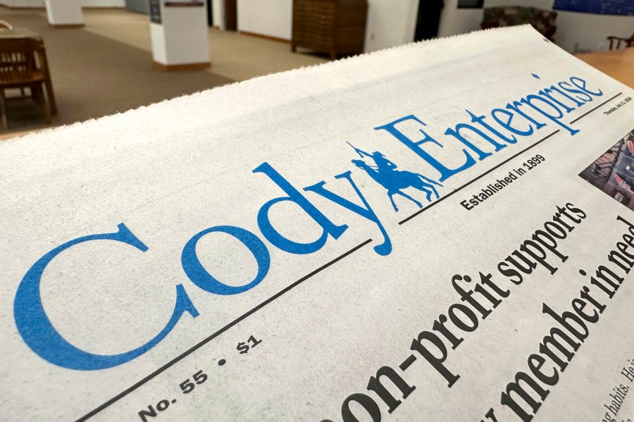 A recent issue of the Cody Enterprise, the Wyoming newspaper where a reporter used artificial intelligence to help write his stories, is seen Tuesday, Aug. 13, 2024, at the Wyoming State Library in Cheyenne. (AP Photo/Mead Gruver)