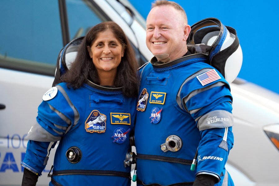 FILE - NASA astronauts Suni Williams, left, and Butch Wilmore stand together for a photo enroute to the launch pad at Space Launch Complex 41 Wednesday, June 5, 2024, in Cape Canaveral, Fla., for their liftoff on the Boeing Starliner capsule to the international space station. (AP Photo/Chris O'Meara, File)