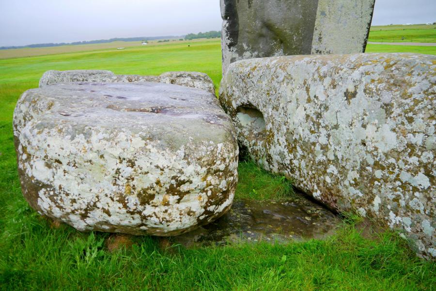 In this photo provided by researchers in August 2024, Stonehenge's Altar Stone lies underneath two Sarsen stones in Wiltshire, England. (Nick Pearce/Aberystwyth University via AP)