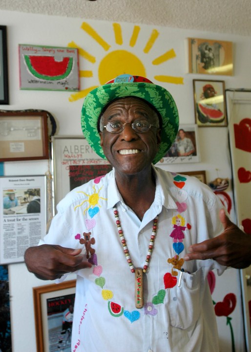 FILE - Wally Amos, of Kailua, Hawaii, is shown in his home office on June 12, 2007, in the Lanikai section of Kailua, Hawaii. Amos, the creator of the cookie empire that took his name and made it famous and who went on to become a children’s literacy advocate, has died at age 88, on Tuesday, Aug. 13, 2024. (AP Photo/Lucy Pemoni, File)