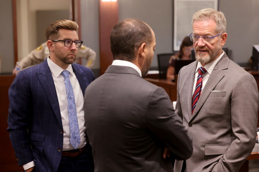 Robert Draskovich, right, and Michael Horvath, left, attorneys for Robert Telles, talk to Chief Deputy District Attorney Christopher Hamner prior to jury selection on the second day of Telles' murder trial at the Regional Justice Center in Las Vegas Tuesday, Aug. 13, 2024. Telles, a former Clark County public administrator, is charged in the murder of Las Vegas Review-Journal investigative journalist Jeff German. (K.M. Cannon/Las Vegas Review-Journal via AP, Pool)