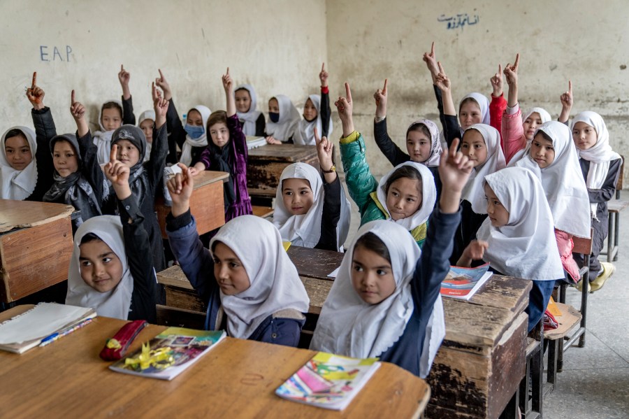 FILE - Afghan school girls attend their classroom on the first day of the new school year, in Kabul, Saturday, March 25, 2023. (AP Photo/Ebrahim Noroozi, File)