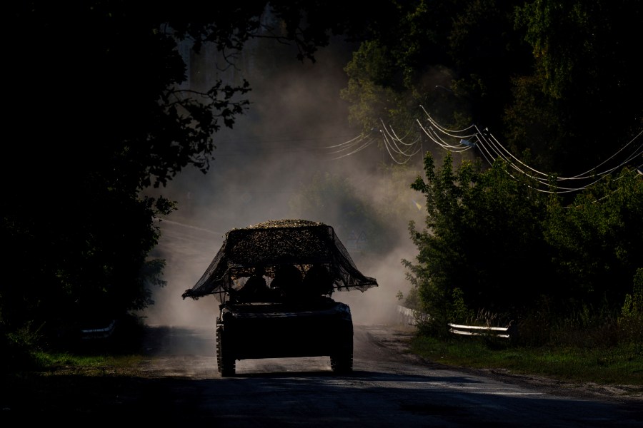 A Ukrainian armoured military vehicle travels near the Russian-Ukrainian border, Sumy region, Ukraine, Wednesday, Aug. 14, 2024. (AP Photo/Evgeniy Maloletka)