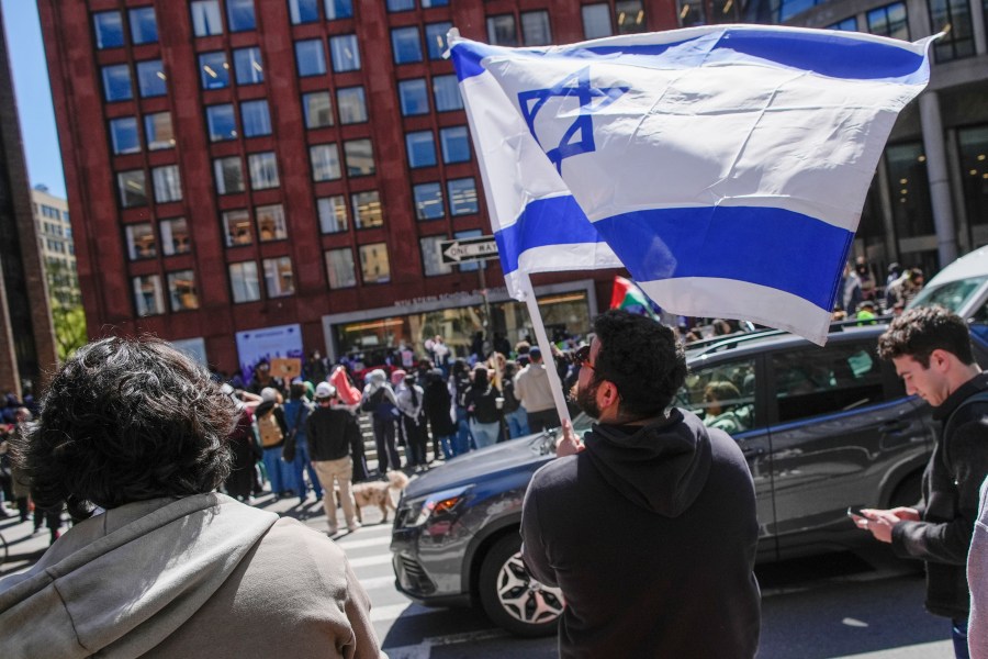 FILE — New York University students and pro-Israeli supporters rally across the street from where Pro-Palestinian students and supporters are rallying outside the NYU Stern School of Business building, April 22, 2024, in New York. (AP Photo/Mary Altaffer, File)