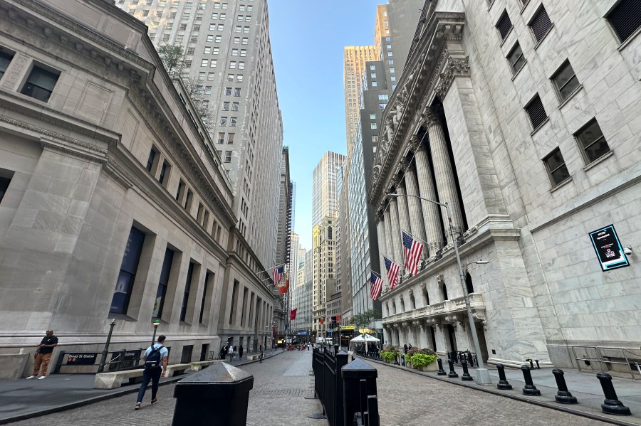 The New York Stock Exchange, at right, is shown on Wednesday, Aug. 14, 2024, in New York. (AP Photo/Peter Morgan)