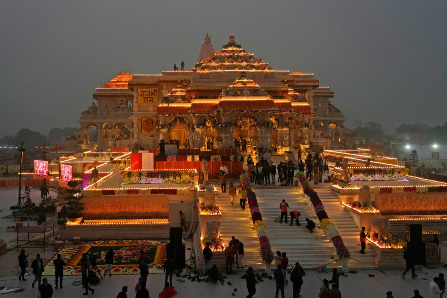 FILE - Workers decorate a temple dedicated to Hindu deity Lord Ram with flowers the day before the temple's grand opening in Ayodhya, India, Sunday, Jan. 21, 2024. (AP Photo/Rajesh Kumar Singh, File)