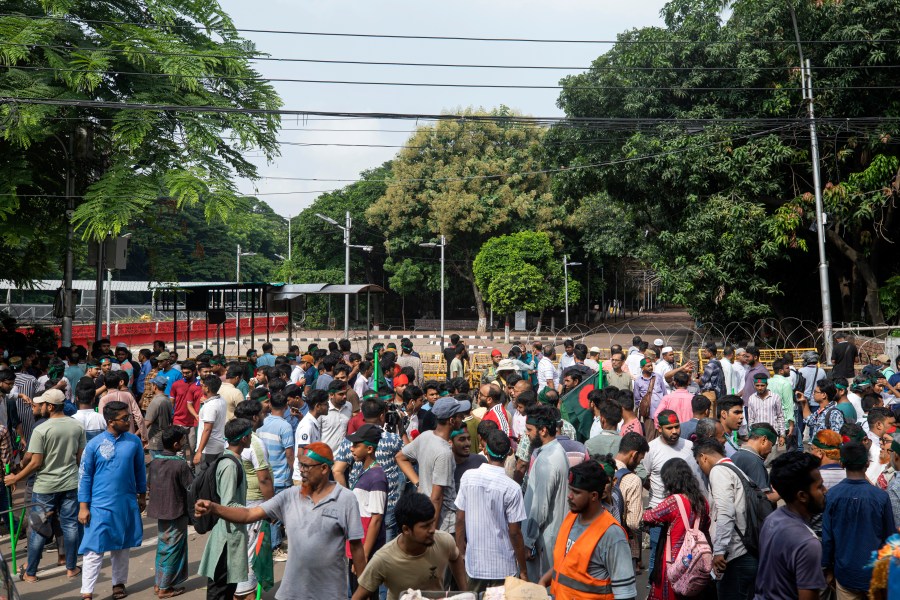 Protesters block the road in front of the former residence of Sheikh Mujibur Rahman, father of the ousted Prime Minister Sheikh Hasina, on his death anniversary in Dhaka, Bangladesh, Thursday, Aug. 15, 2024. (AP Photo/Rajib Dhar)