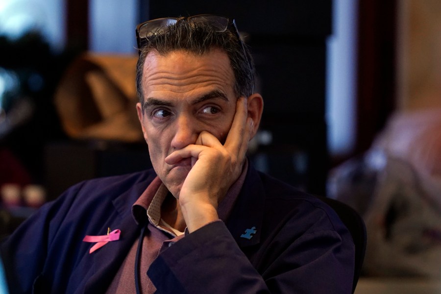 Trader Gregory Rowe works on the floor of the New York Stock Exchange, Friday, Aug. 16, 2024. (AP Photo/Richard Drew)