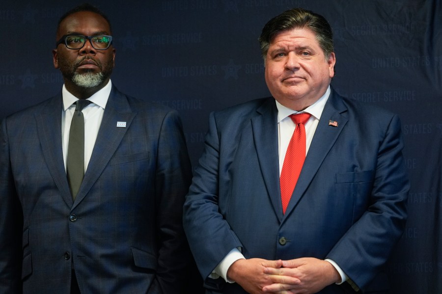 Illinois Gov. JB Pritzker, right, stands with Chicago Mayor Brandon Johnson during a Democratic National Convention security briefing at the U.S. Secret Service's Chicago Field Office Thursday, July 25, 2024, in Chicago. (AP Photo/Erin Hooley)