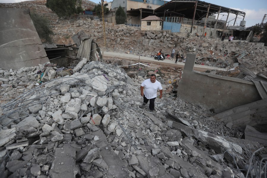 A man inspects an industrial area destroyed by an Israeli airstrike, in Wadi al-Kfour, Nabatieh province, south Lebanon, Saturday, Aug. 17, 2024. (AP Photo/Mohammed Zaatari)