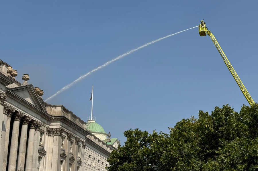 Firefighters battle a fire at Somerset House in central London. Saturday Aug. 17, 2024, after a fire broke out the large neoclassical arts venue. (Shivansh Gupta/PA via AP)