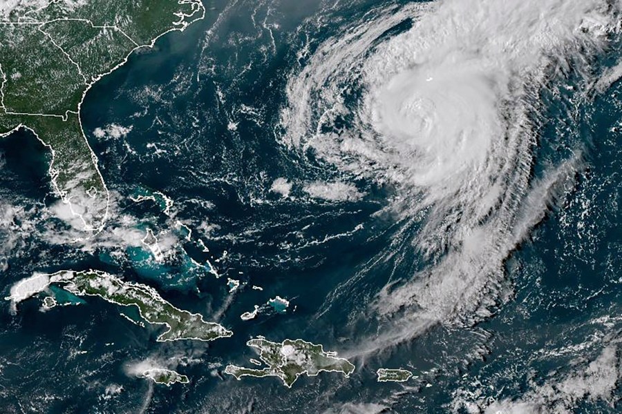 This GOES-16 GeoColor satellite image taken at 4:40 p.m EDT and provided by National Oceanic and Atmospheric Administration (NOAA) shows Hurricane Ernesto in the Atlantic Ocean south-southwest of Bermuda, Friday, Aug. 16, 2024. (NOAA via AP)