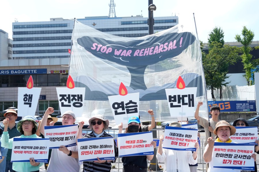 South Korean protesters stage a rally to oppose the joint military exercises, Ulchi Freedom Shield or UFS, between the U.S. and South Korea in front of the presidential office in Seoul, South Korea, Monday, Aug. 19, 2024. The banners read " Opposition to nuclear war exercise." (AP Photo/Ahn Young-joon)