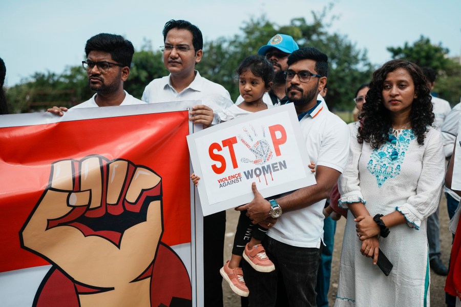 Indians protesting against the rape and killing of a trainee doctor at a government hospital in Kolkata hold placards in Mumbai, India, Monday, Aug. 19, 2024. (AP Photo/Rafiq Maqbool)