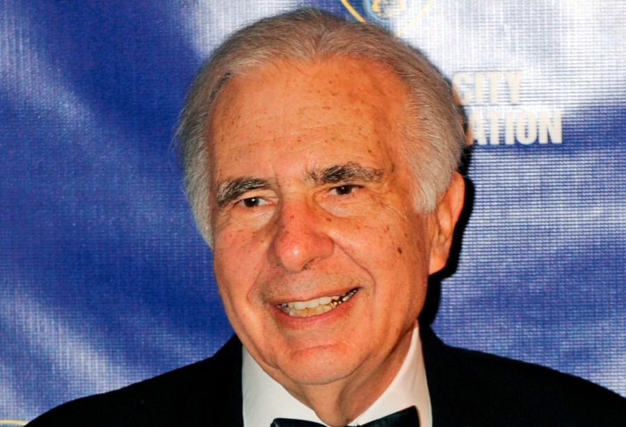 FILE - Financier Carl Icahn poses for photos upon arriving for the annual New York City Police Foundation Gala in New York, March 16, 2010. (AP Photo/Henny Ray Abrams, File)