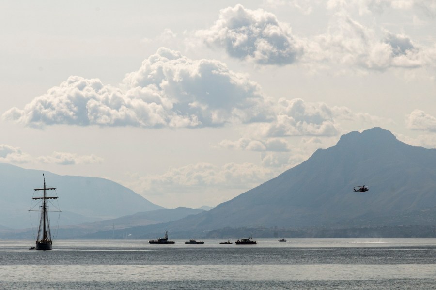 Rescuers work in the area where the UK flag vessel Bayesan that was hit by a violent sudden storm, sunk early Monday, Aug. 19, 2024, while at anchor off the Sicilian village of Porticello near Palermo, in southern Italy. (AP Photo/Lucio Ganci)