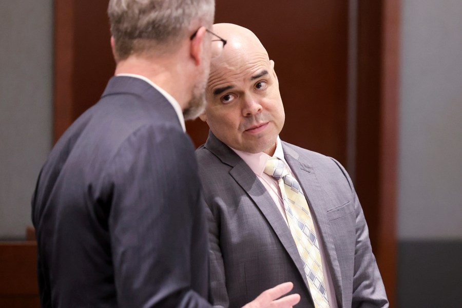 Robert Telles, a former Clark County public administrator charged in the murder of Las Vegas Review-Journal investigative journalist Jeff German, right, talks with attorney Robert Draskovich during a break in testimony during his murder trial at the Regional Justice Center in Las Vegas, Friday, Aug. 16, 2024. (K.M. Cannon/Las Vegas Review-Journal via AP, Pool)