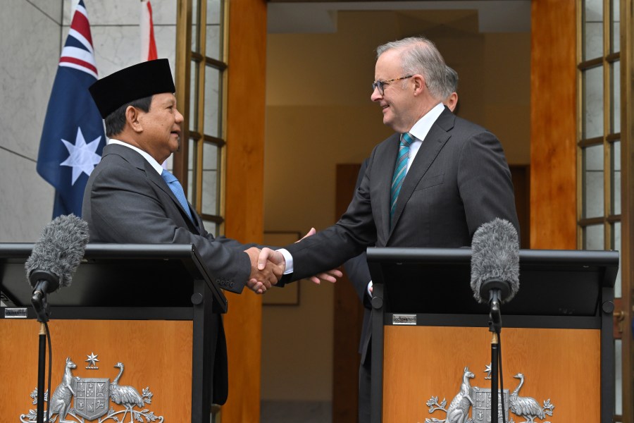 Indonesia's President-elect Prabowo Subianto, left, and Australian Prime Minister Anthony Albanese shake hands following a joint statement at Parliament House in Canberra, Australia, Tuesday, Aug. 20, 2024. (Mick Tsikas/AAP Image via AP)