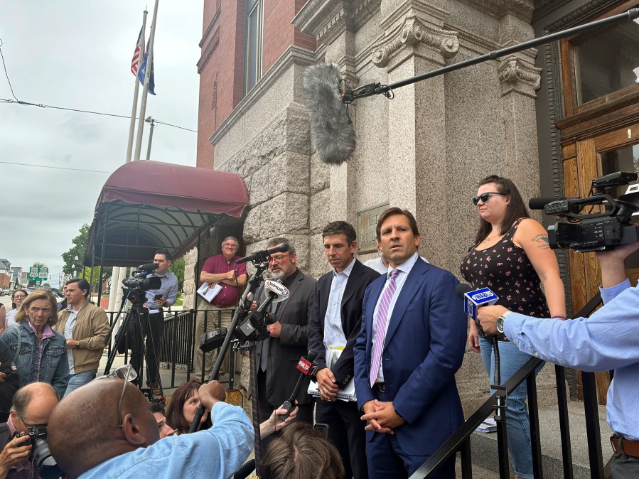 Attorney Ben Gideon attorney for victims of the Lewiston mass shooting and their families, talks to reporters outside Lewiston City Hall, on Tuesday, Aug. 20, 2024, in Lewiston, Maine. (AP Photo/Patrick Whittle)