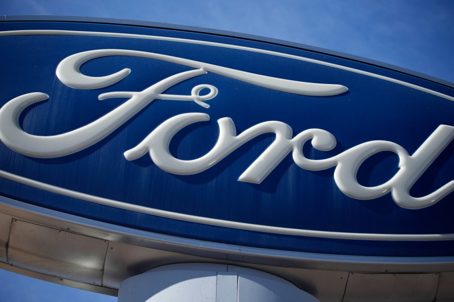 FILE - A Ford company logo on a sign at a Ford dealership in southeast Denver, Oct. 24, 2021. (AP Photo/David Zalubowski, File)