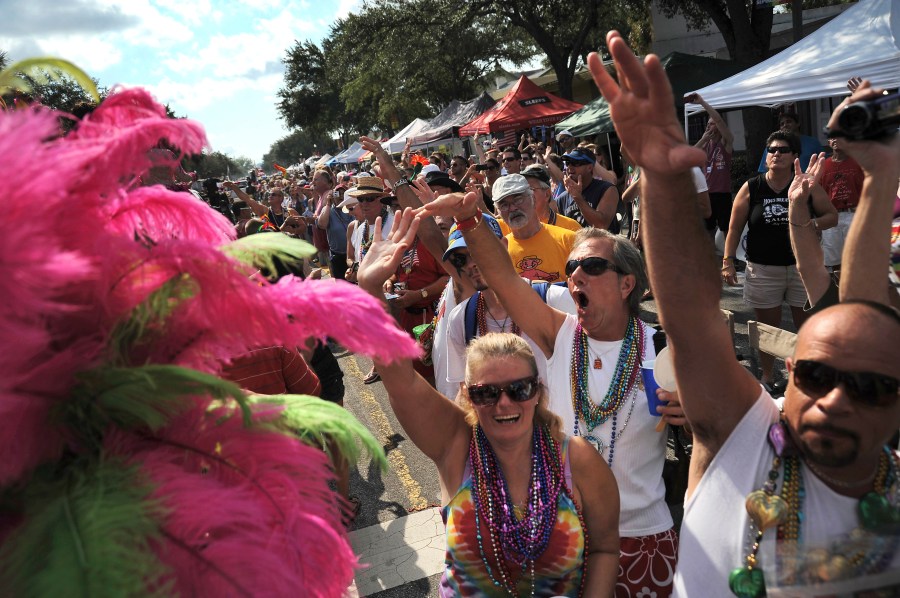 FILE - Hundreds of people line Central Avenue and cheer during the 10th Annual St. Pete Pride Street Festival & Promenade in St. Petersburg, Fla. on June 30, 2012. (Leah Millis/Tampa Bay Times via AP, file)