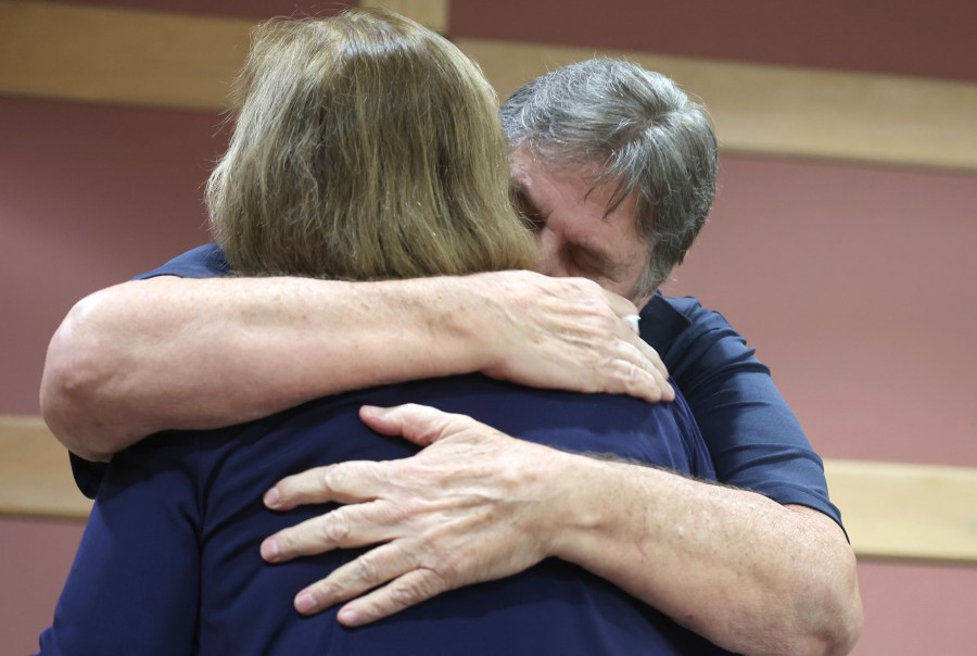 Joe and Rae Dowling comfort each other during a hearing for Terry McKirchy, the babysitter charged with murder for the death of their son Benjamin Dowling after she allegedly permanently injured him by shaking him as a 5-month-old in the 1980s, at the Broward County Courthouse in Fort Lauderdale, Fla., Wednesday, Aug. 21, 2024. (Carline Jean/South Florida Sun-Sentinel via AP, Pool)