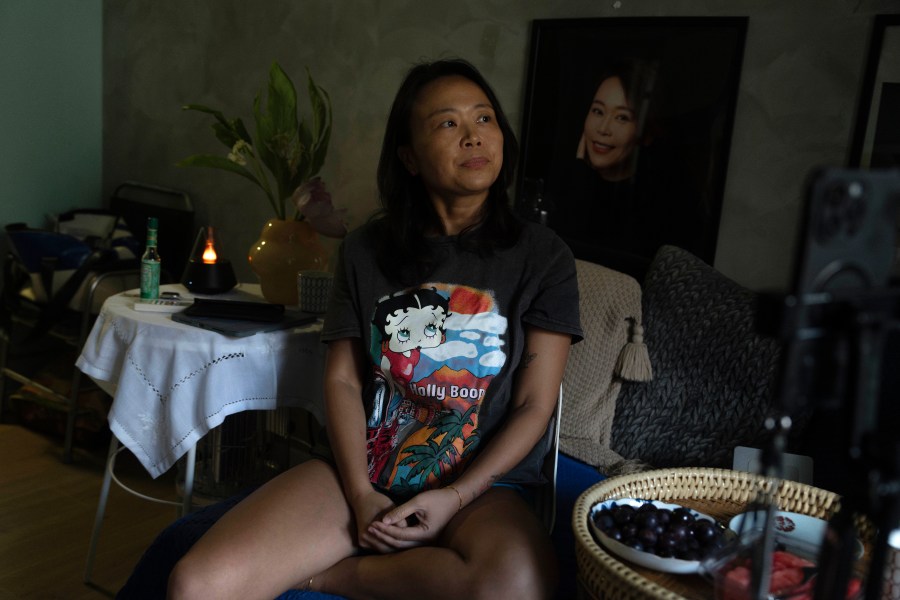 Zhang Peiyi, a Shanghai resident, reacts during an interview at her home in Shanghai on July 31, 2024. (AP Photo/Ng Han Guan)