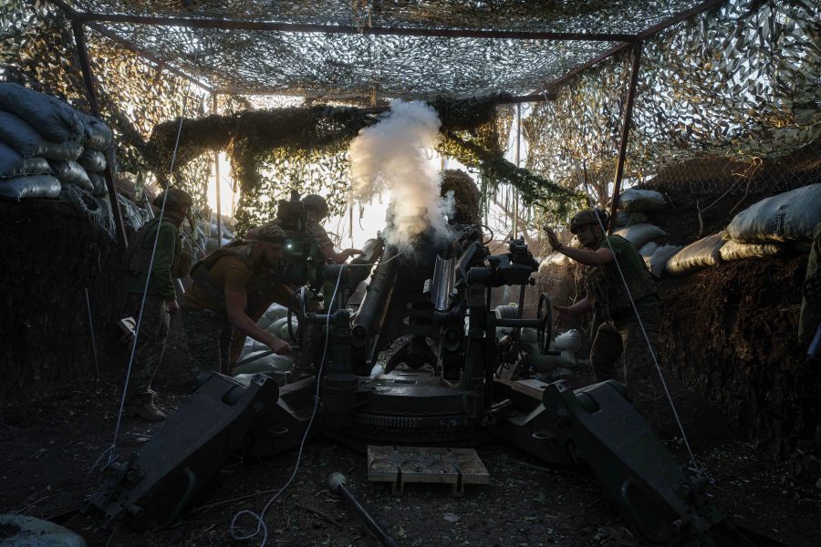 Ukrainian servicemen of 148th separate artillery brigade of the Air Assault Forces fire towards Russian positions by a M777 howitzer at the frontline in Donetsk region, Ukraine, Wednesday, August 21, 2024. (AP Photo/Evgeniy Maloletka)