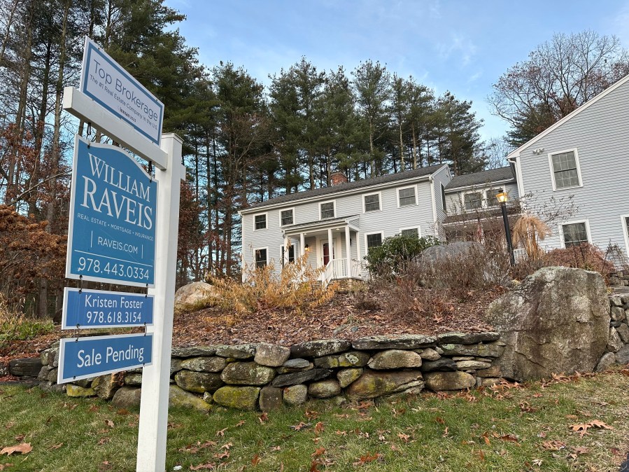 FILE - A sale pending sign is displayed in front of a home in Sudbury, Mass. on Saturday, Dec. 2, 2023. (AP Photo/Peter Morgan, File)