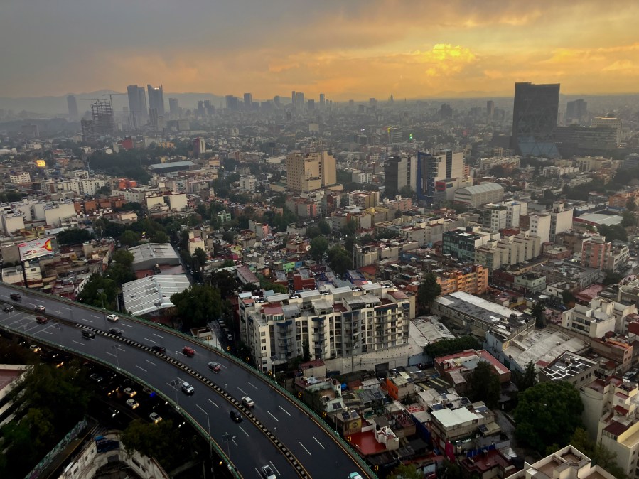 FILE - The sun sets in Mexico City after heavy rain, July 25, 2024. (AP Photo/Marco Ugarte, File)