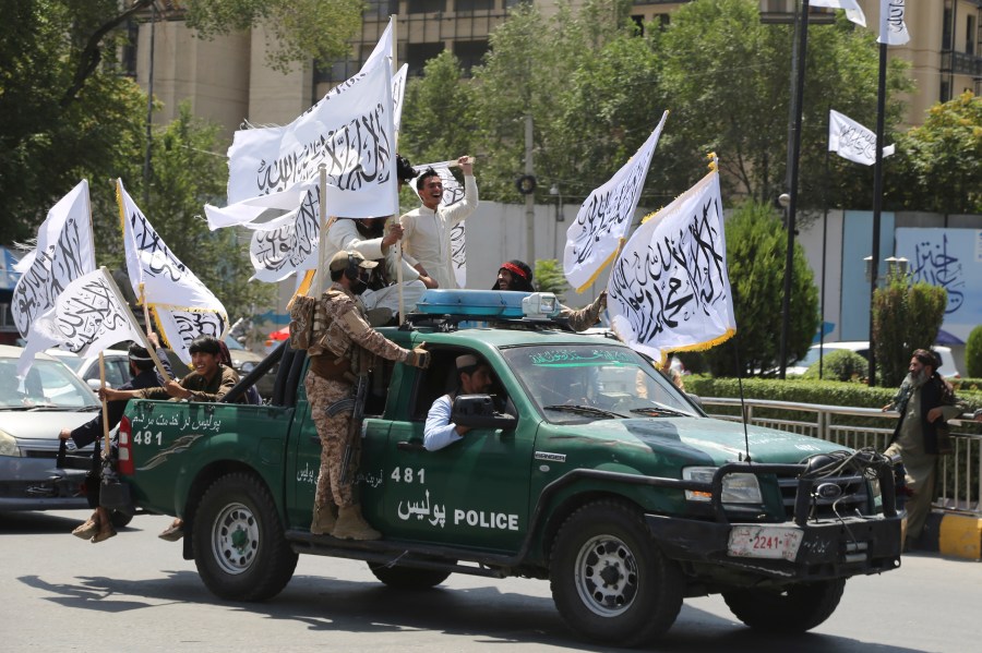 Taliban fighters celebrate the third anniversary of the withdrawal of US-led troops from Afghanistan, in Kabul, Afghanistan, Wednesday, Aug. 14, 2024. (AP Photo/Siddiqullah Alizai)