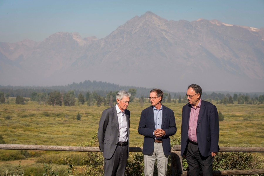 Federal Reserve Chairman Jerome Powell, left, Governor of the Bank of Canada Tiff Macklem, center, and Governor of the Bank of England Andrew Bailey chat outside the Jackson Hole Economic Symposium at Jackson Lake Lodge in Grand Teton National Park near Moran, WY on Aug. 23, 2024. (AP Photo/Amber Baesler)