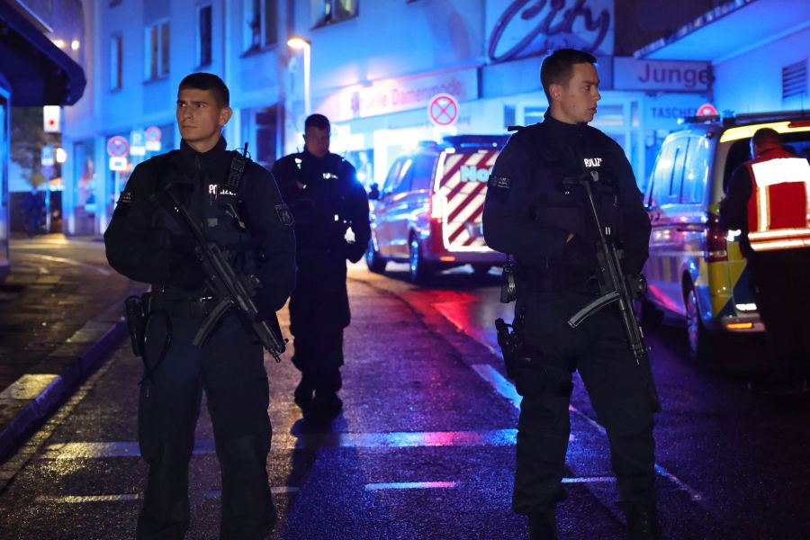 Police and ambulances near the scene where people were killed and injured in an attack at a festival in Solingen, western Germany, the German dpa news agency reported, Friday, Aug. 23, 2024. (Gianni Gattus/dpa via AP)