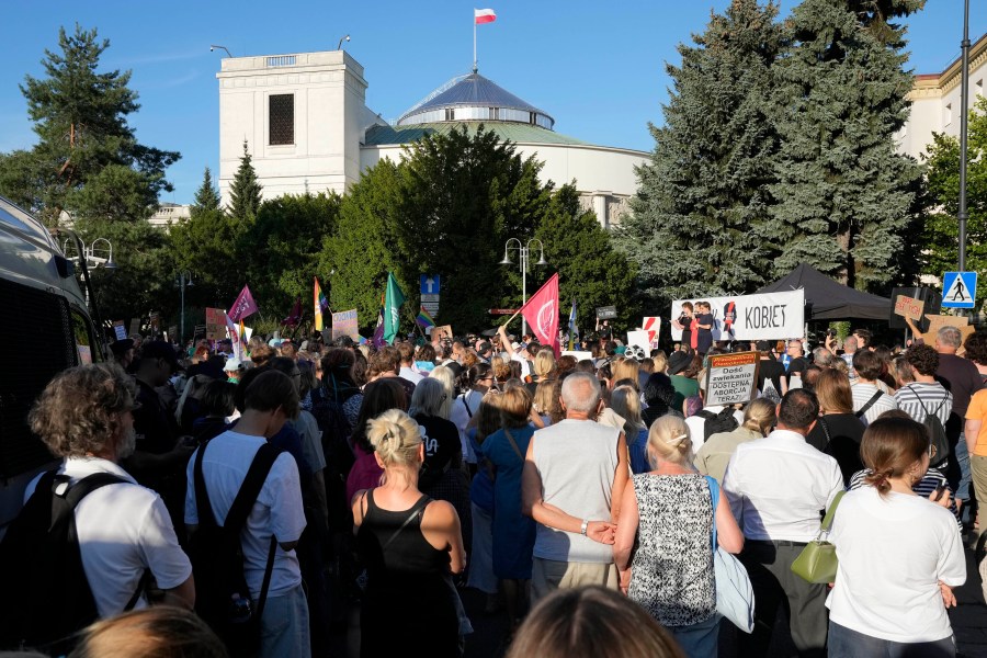 FILE - A few hundred people protest the recent failure by the centrist government of Prime Minister Donald Tusk to muster sufficient support for a vote to liberalize the country's strict anti-abortion law outside the parliament building in Warsaw, Poland, July 23, 2024. (AP Photo/Czarek Sokolowski, File)