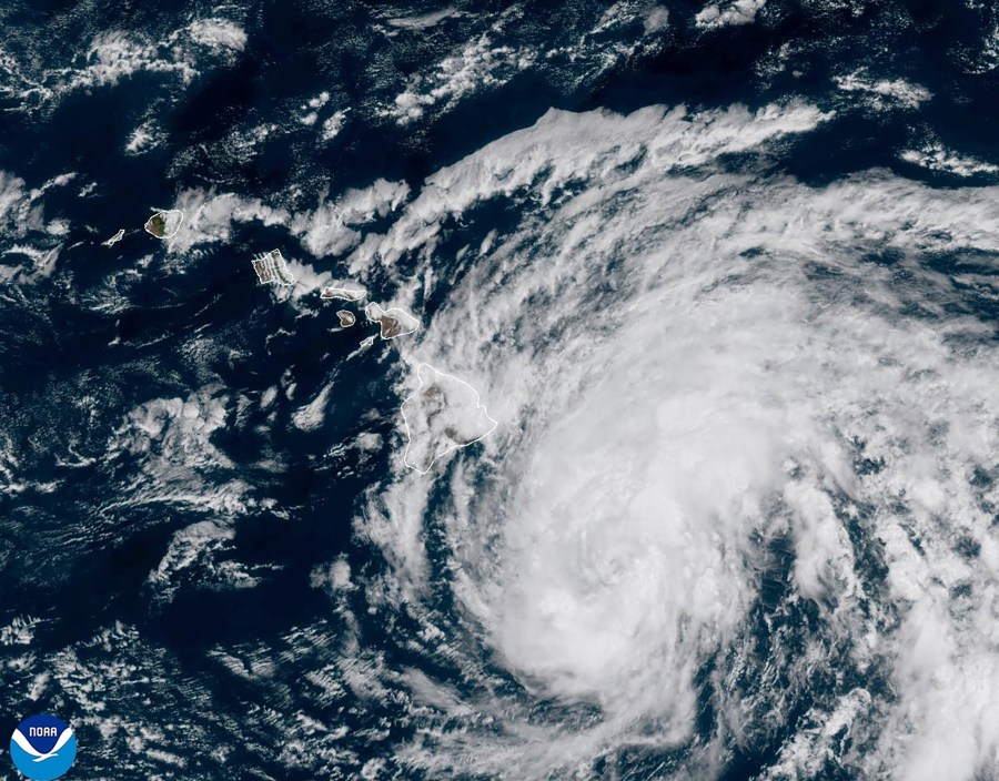 This image provided by the National Oceanic and Atmospheric Administration shows Tropical Storm Hone as it continues to track to the west toward the Hawaiian Islands, Saturday, Aug. 24, 2024. (National Oceanic and Atmospheric Administration via AP)