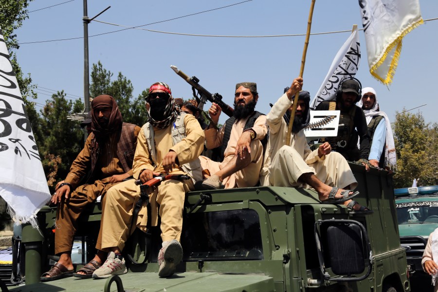 Taliban fighters celebrate the third anniversary of the withdrawal of US-led troops from Afghanistan, in Kabul, Afghanistan, Wednesday, Aug. 14, 2024. (AP Photo/Siddiqullah Alizai)