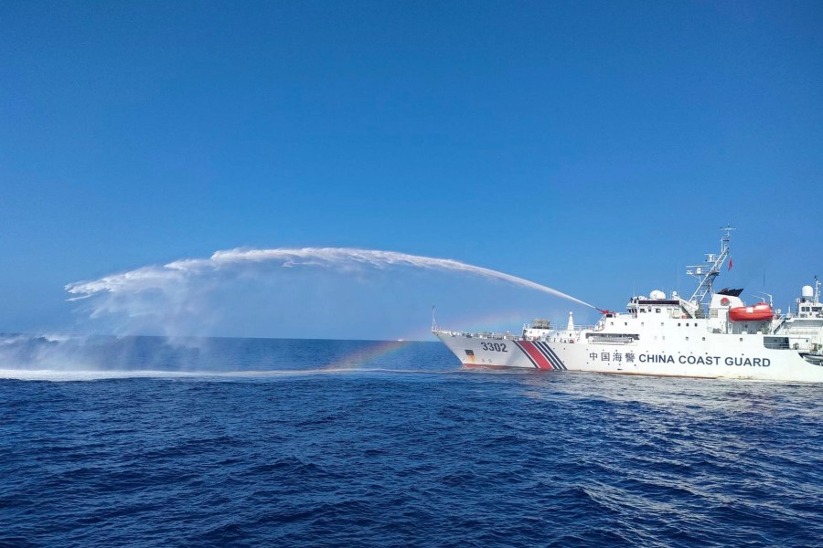 FILE - In this photo provided by the Philippine Coast Guard, a Chinese Coast Guard ship, right, uses its water cannons on a Philippine Bureau of Fisheries and Aquatic Resources (BFAR) vessel, as it approaches Scarborough Shoal in the disputed South China Sea, on Dec. 9, 2023. (Philippine Coast Guard via AP, File)