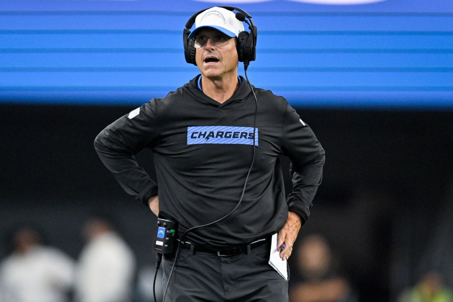 Los Angeles Chargers head coach Jim Harbaugh looks on from the sideline during the second half of a preseason NFL football game against the Dallas Cowboys, Saturday, Aug. 24, 2024, in Arlington, Texas.(AP Photo/Jerome Miron)